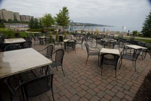 Outdoor seating area next to lake superior