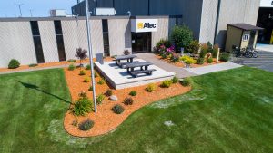 landscaping with various shrubs outside of a place of business called Altec