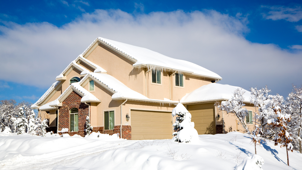 House covered in snow in water