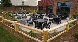 outdoor seating area with various black chairs and tables