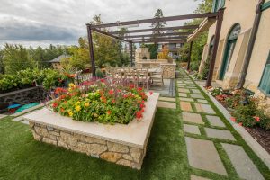 backyard landscape with flowers and stone path