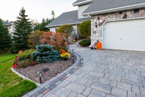landscaping in front of house with flowers and shrubs