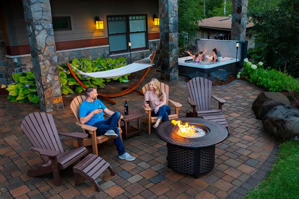 Paver patio with hot tub and fire feature. 